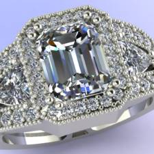Custom three stone Emerald and trillion diamond ring