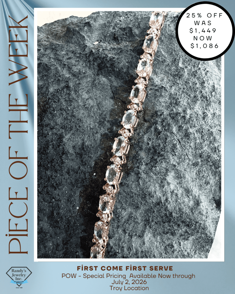 6.29Troy POW Gold-tone bracelet with large clear stones resting on a textured gray rock, part of a jewelry promo titled 'Piece of the Week'.